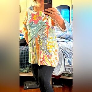 You’ll love this 3/4 sleeve, brightly colored knit top from Atelier 5!